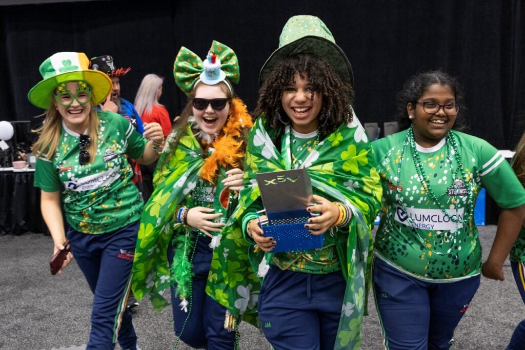 The SHS STEMinists smile after receiving an award at the VEX Robotics World Championship.