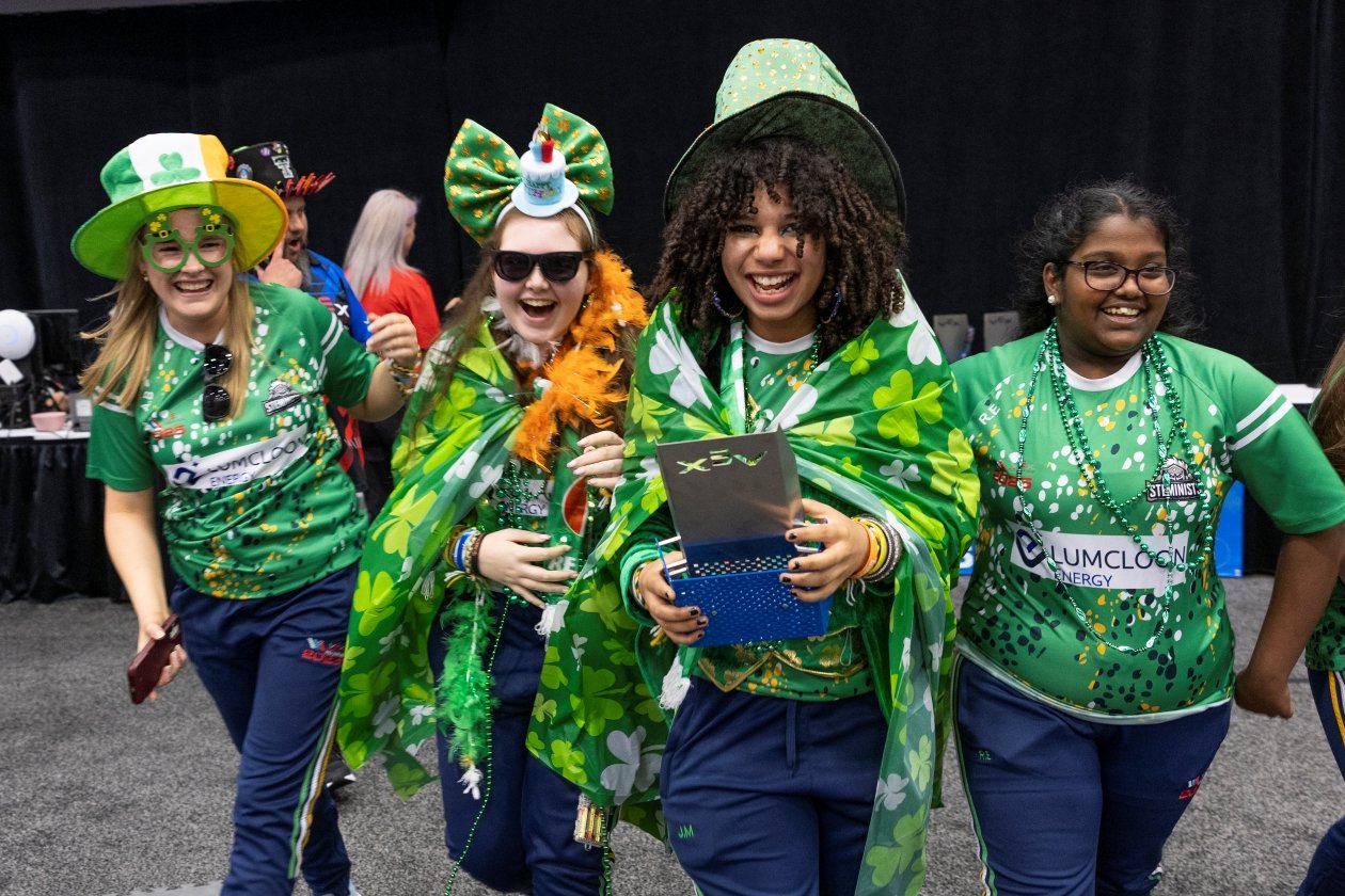 The SHS STEMinists smile after receiving an award at the VEX Robotics World Championship.