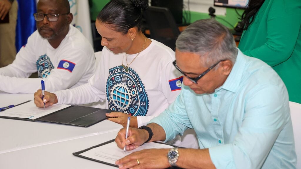 Hon. John Briceño and Jamie Lee Usher attend the signing event for the Belize Robotics Federation.