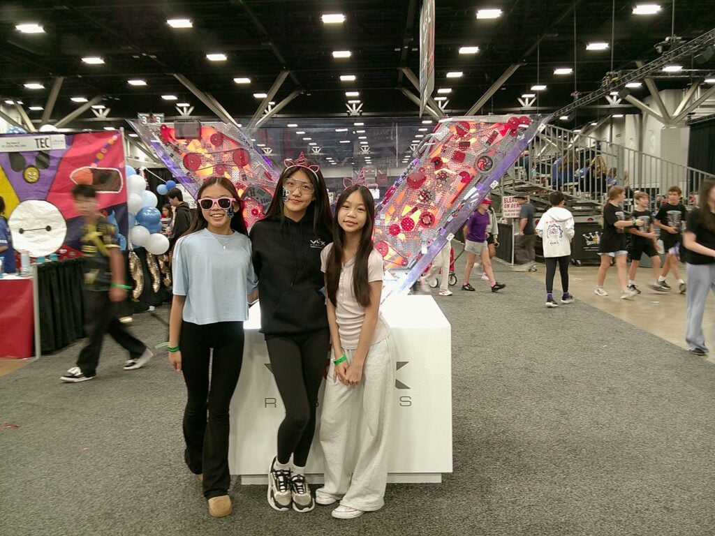 An image by Team 69955B Big Hero 6 the team standing in front of the V sign at VEX Worlds.