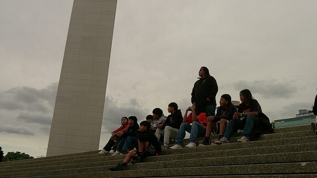 An image by Team 72777B Mt. Baldy Warriors of the team sitting on the stairs by the Gateway Arch.
